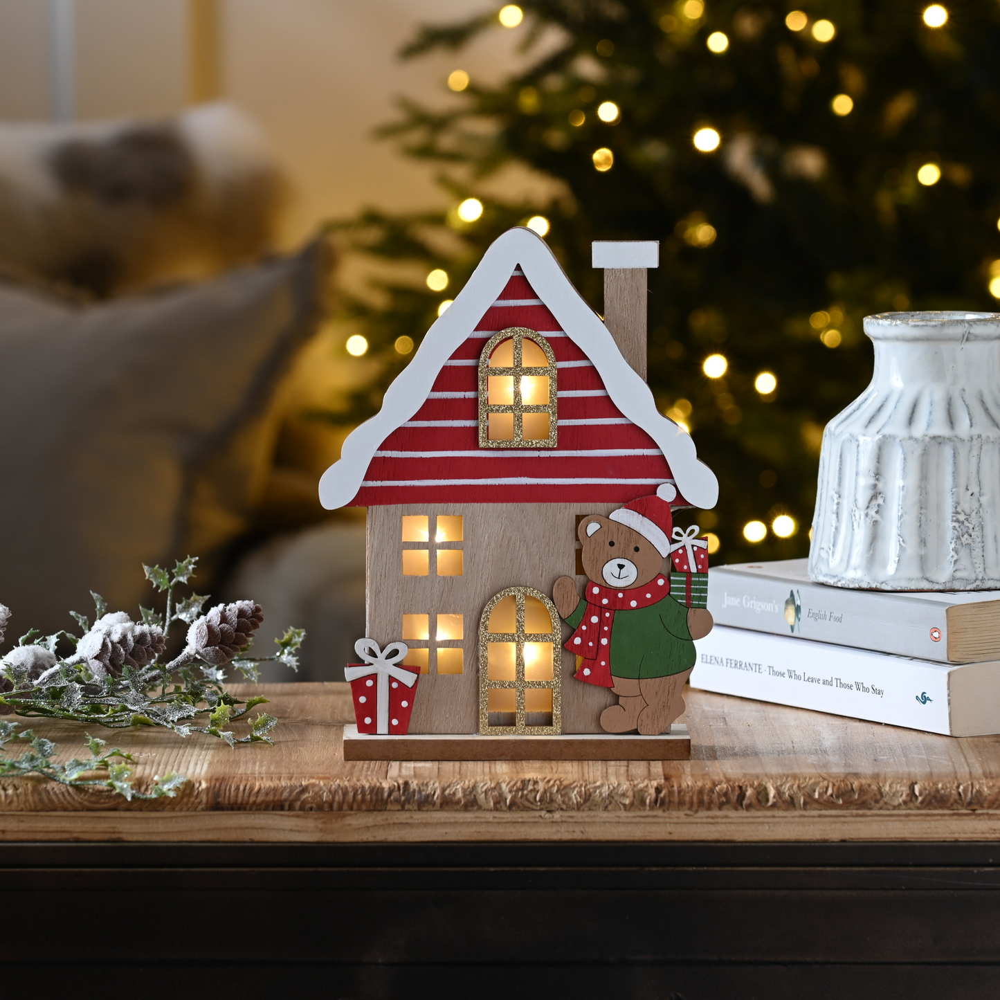 Lit Wooden House with Christmas Bear Decoration