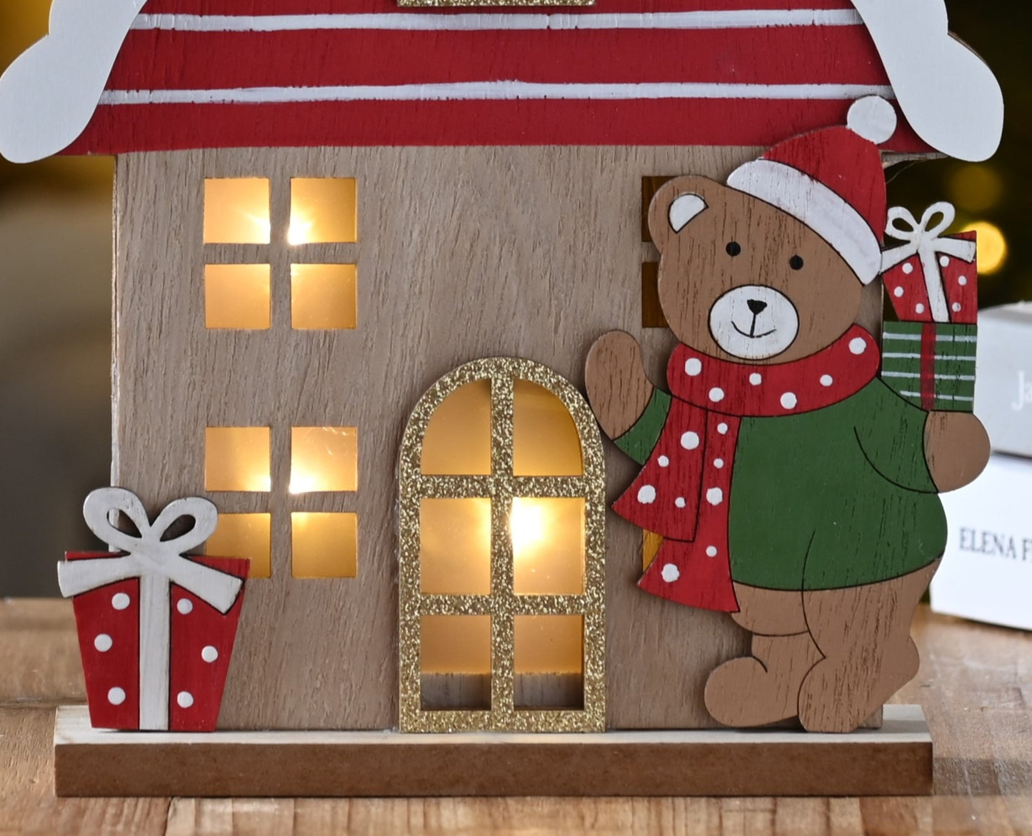 Lit Wooden House with Christmas Bear Decoration